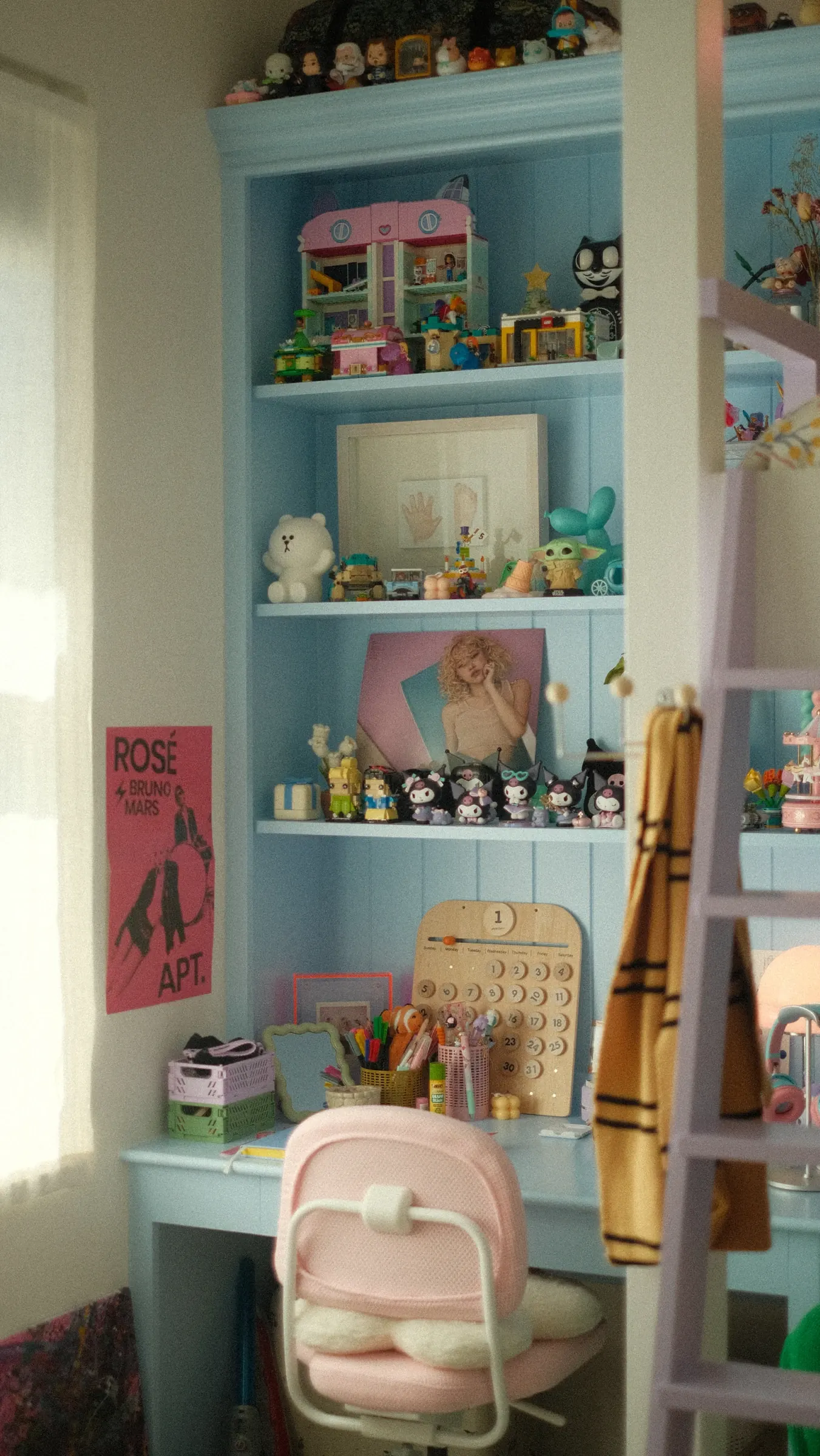 Blue shelves and a desk Edmond built for his daughter, filled with her toys and treasures.
